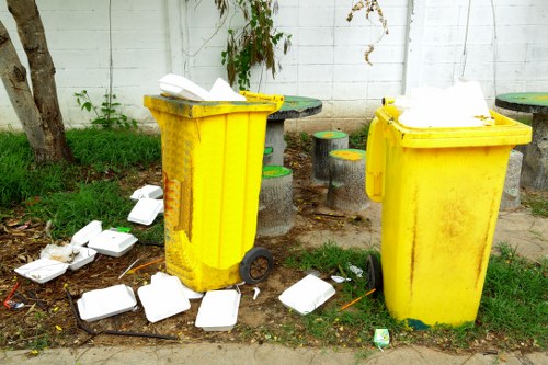Professional furniture removal service in St Albans preparing items for recycling.